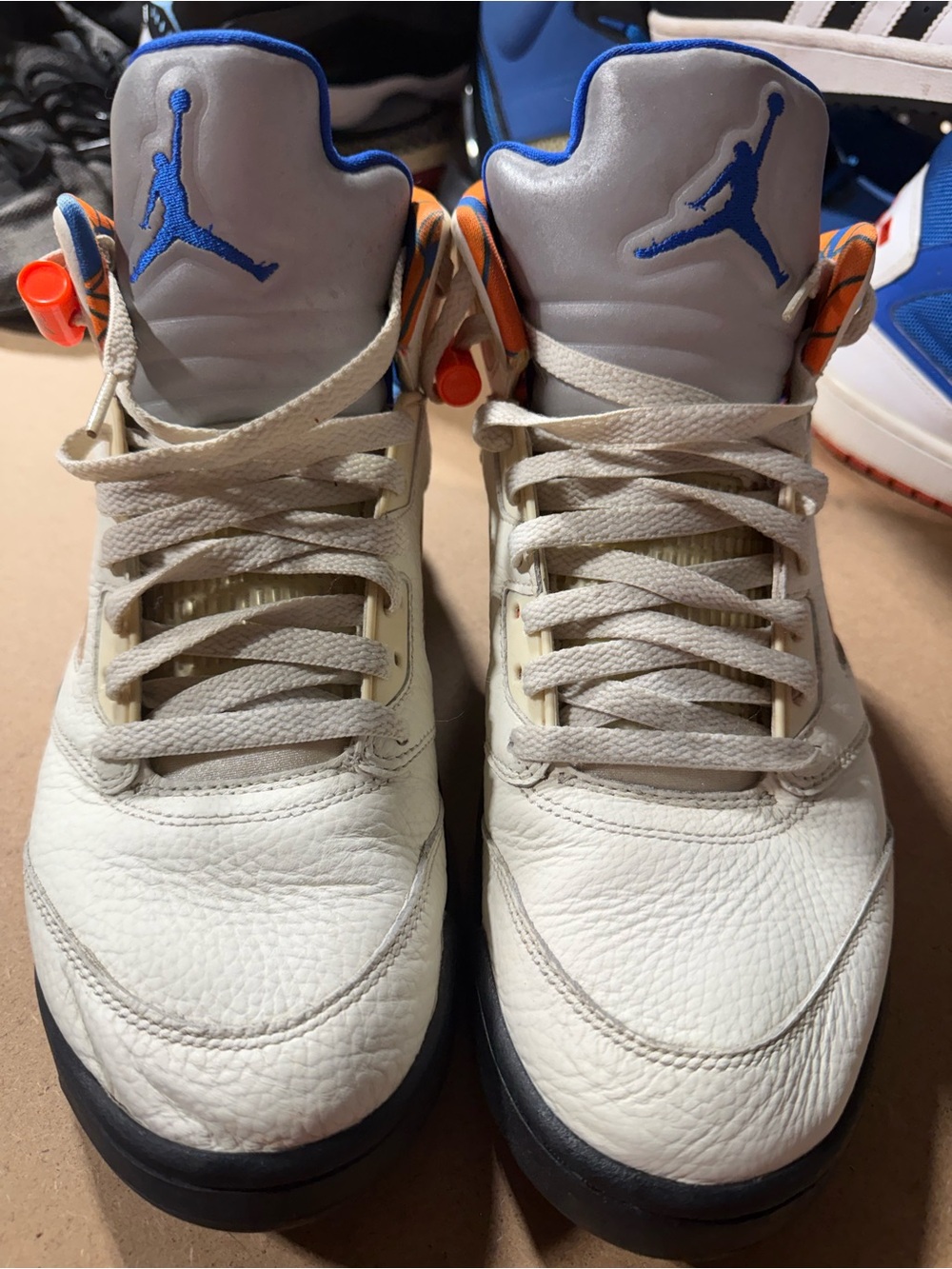 Jordan Kids White Sneakers with Blue Jumpman and Orange Accents